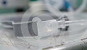 Macrostyle medium shot of oxygen mask strap and connector detail on a bench sharp focus on textures contrasted by