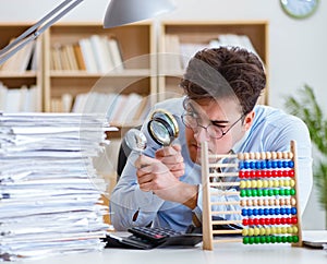 Mad auditor looking for errors in the report