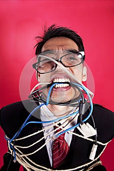 Mad businessman with cables