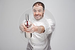 Mad Chef Holding Cream Whipper