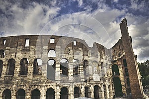 Mad clouds and Colisseum old building in Rome city, Italy