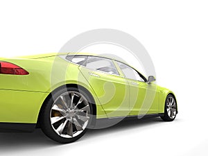 Mad lime green modern electric sports car - rear wheel closeup shot