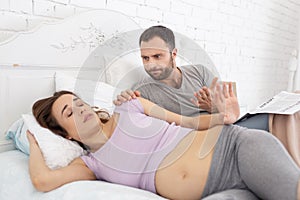 Mad man awaking pregnant woman