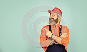 Mad repairman concept. man wear boilersuit. bearded worker in overalls. Confident Mature Mechanic. Portrait Of Repairman