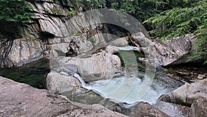 Mad River Valley Vermont  crystal clear blue water and waterfalls through rocky outcrop forest in summer