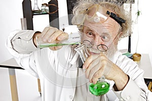 Mad scientist conducts chemistry experiment photo