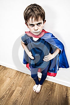 Mad superhero boy being outraged by denigrating education, contrast effect