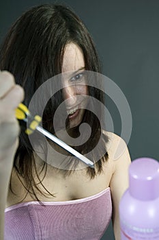 Mad woman stabbing the hair spray