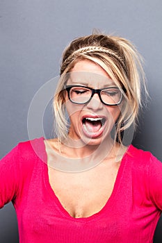 Mad young blond woman shouting her exasperation