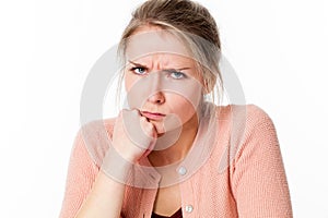 Mad young blond woman sulking, frowning her exasperation