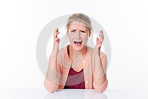 Mad young woman expressing herself with nervous hands, shouting stress