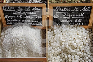 Madagascar fleur de sel salt and African salt pearls at a market Antibes, France