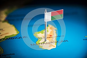 Madagascar marked with a flag on the map photo