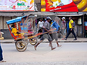 : Barefoot men pull rickshaws in Ansirabe, southern Madagascar. November 09.2022 Madagascar