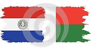 Madagascar and Paraguay grunge flags connection vector