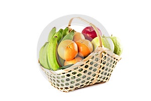 Madarin orange, guava fruit, banana and red apple in gift basket on white background fruit health food isolated