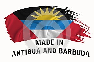 Made in antigua and barbuda handwritten vintage ribbon flag, brush stroke, typography lettering logo label banner on white photo