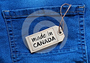 Made in Canada tag on blue jean background.