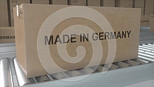 Made in GERMANY import and export concept. Cardboard boxes with product from GERMANY on the roller conveyor