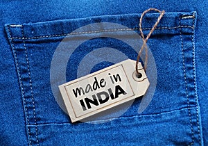 Made in India tag on blue jean background.