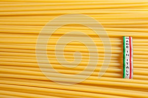 Made in Italy label over uncooked Italian spaghetti