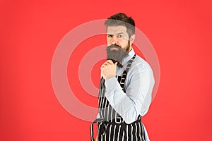 Made right choice. bearded man in chef apron. brutal waiter on kitchen. mature man red background. skilled servant