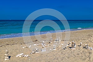 Made of stone tower on the beach. Balanced pebbles on beach