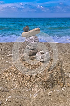 Made of stone tower on the beach. Balanced pebbles on beach