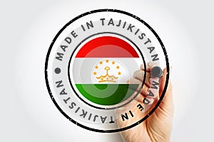 Made in Tajikistan text emblem stamp, concept background