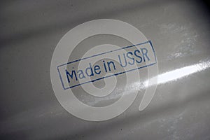 `Made in USSR` stamp sign on a metal surface. Toned