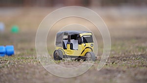 Made with your own hands on the toy in a Asian taxi `tuk tuk`on the grass