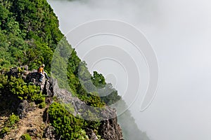 Madeira holiday summer trip vacation tourism mountains sunny day green trees landscape man sit on rock