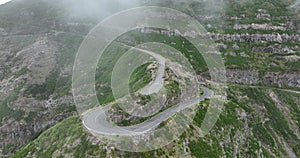 Madeira island, mountain road through the clouds with cliffs and beautifull nature surrounded on a sunny misty day in