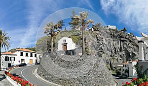 Panoramic view at the St. AntÃ³nio church on Ponta do Sol, a small touristic village in the city of Funchal, buildings and cliffs photo