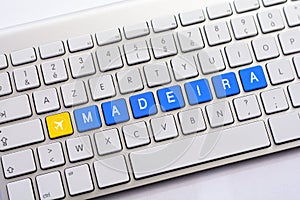 MADEIRA writing on white keyboard with a aircraft sketch