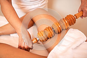 Maderotherapy with a wooden roller photo