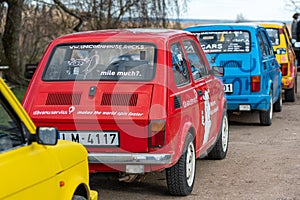 Row of colorful stylish vintage Fiat 126 PanCars rental cars, PanCars is a car rental company