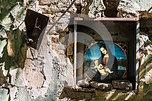 Madonna and child in ruined church