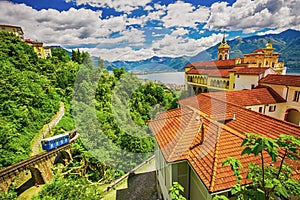 Madonna del Sasso Church in Locarno city, Lake Maggiore and Swiss Alps in Ticino, Switzerland.