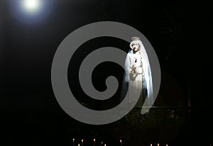Madonna in strong beam of light