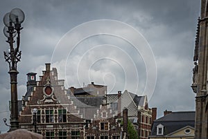 Madonna on the wall overlooking the gable houses of Ghent, Belgium