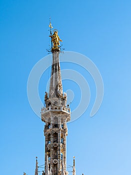 Madonnina golden statue on top of Milan Cathedral