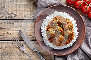 Madras butter Beef spicy asian garam masala slow cook lamb food with rice and tomatoes