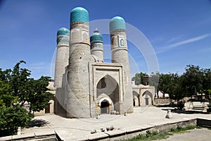 Madrasah Chor Minor among greenery in Bukhara in Uzbekistan