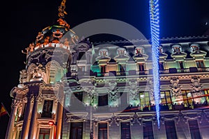 Madrid at Christmas. Night view of the Metropolis building of Ma