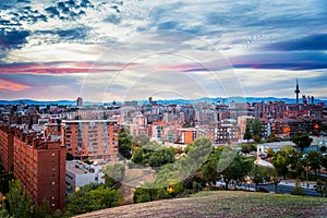 Madrid cityscape at sunset with purple clouds