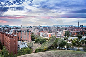 Madrid cityscape at sunset with purple clouds