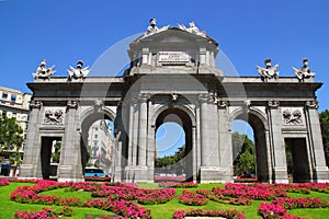 Madrid Puerta de Alcala with flower gardens photo