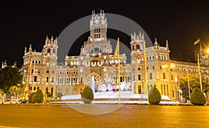 Madrid / Spain - 02 August 2019: Night sight in the famous spot of the sculpture Cibeles, iluminated and the post office in the