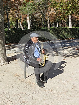 Street musician playing saxophone in Madrid